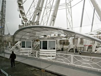 Saturday morning, November, Paris. The ferris wheel was not yet open for business. Workers were festooning it with Christmas lights while we were there.
