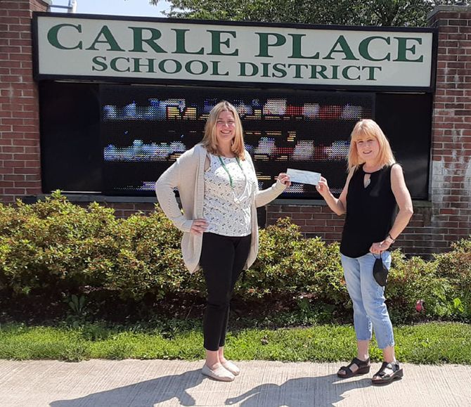 Danny's wife Karen (on right) presenting the first scholarship check