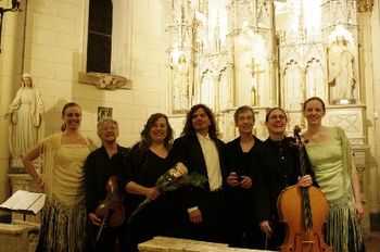 Violist Marke Talley, violinists Ellen Chavez de Leitner and Jane Snyder, cellist Candace Brower, surrounded by Cecilia and Rose Leitner, who played castanets, after a performance at Loretto Chapel