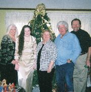Christmas 2006 with Cheryl's parents, the Loopers: Cheryl, Troye (trying on new dress), Marie Looper, Coleman Looper and Tom