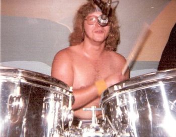 "Coop" bangs out the beat to cover tunes like Elf's "Hoochie Coochie Lady," Sweet's "Fox on the Run," and the ShadowFox originals, "Rocker" and "Goin' Home."