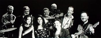 This photo and headliner image shot at Intermedia Arts MN by Kevin Pomeroy. New X - Front row: Angelica Star, Jenny Kouba, Billy X., Kelly Coyle. Back row: Sean Dalton, James B. Quick, Pete Hansen, D.
