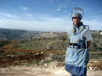 NABATIEH, LEBANON December 2008. Here I am in full protective gear in Southern Lebanon. In the background, some brave guys from the Lebanese Army are clearing cluster bombs from an olive orchard. On