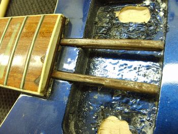 I removed the truss rods for inspection and rethreading, and took that opportunity to reglue the fretboard separation....