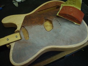 Filler and sanding sealer coats are finished. The surface is sanded level and prepped for top coats.