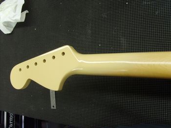 Here, I have sprayed a couple of coats of tinted lacquer, which will serve as the base for my faux graining/camouflage....