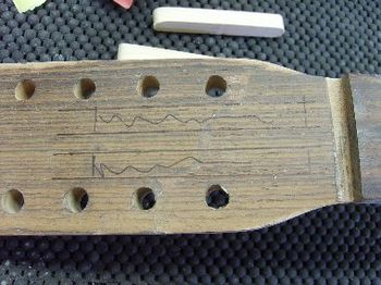 This Martin 12-string suffered a broken headstock. Here, I have glued it back together, and am preparing to reinforce the repair.
