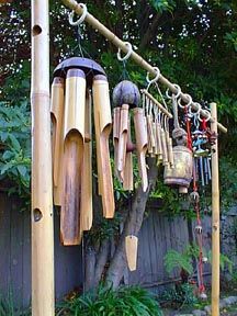 This is what's known as a Chime Tree. It suspends Bamboo Wind Chimes from the Philippines & Cameroon; Brass Wind Chimes from China; and Brass Temple & Elephant Bells from India. The bamboo rack was originally used for hanging shirts at a now defunct Hawaiian gift shop. When the shop folded, rack was sold for a song.