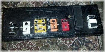 My current pedal board, I say current because both the effects and the board change every so often. The order is Guitar into Boss TU-3 tuner, Crybaby Classic Wah, MXR Dyna Comp, MXR Phase 90, T-REX Yellow Drive, MXR Micro Amp and MXR Carbon Copy Delay. If I'm using a two amp setup then I would also have a Whirlwind A-B Selecter