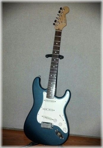 Fender American made Stratocaster with a rosewood fingerboard, sounds great but I play the other one with the Maple board more