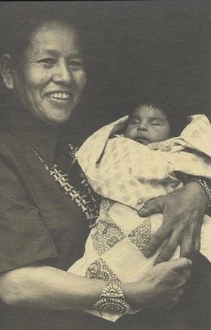 Navajo woman holding baby for First Laugh Ceremony ,on Greg Tamblyn's Humor Blog