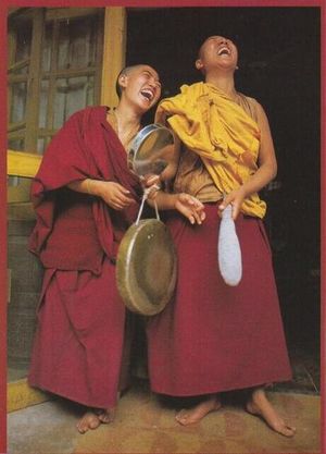 Two buddhist lamas laughing out loud