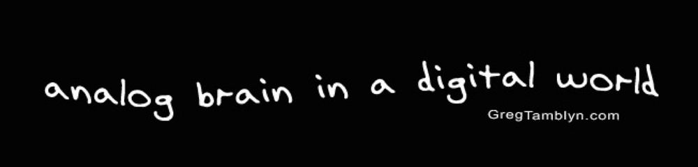 Image of Greg Tamblyn t-shirt with slogan: analog brain in a digital world, white lettering on black shirt.