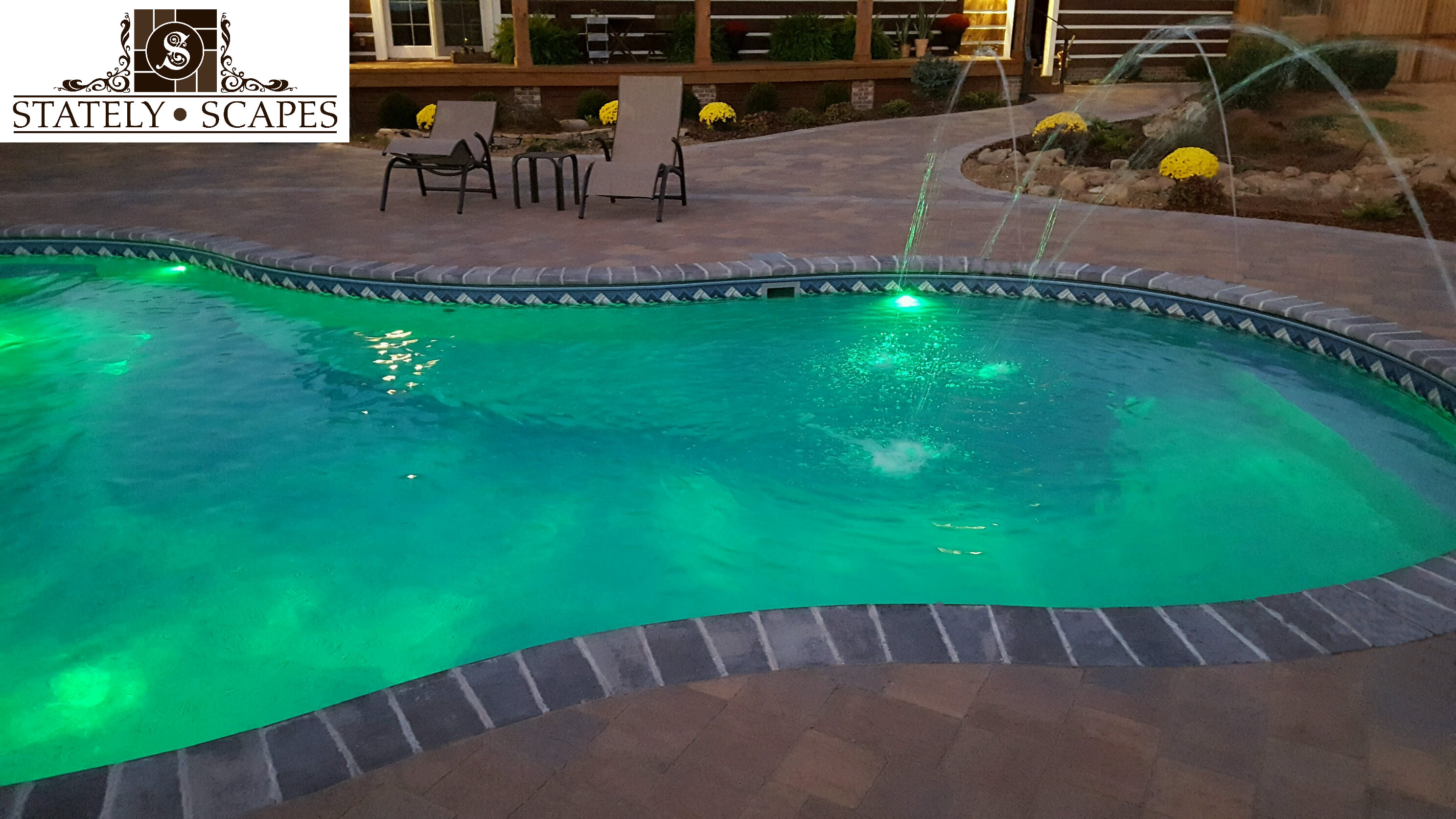 Matrix pool with deck jets and Pentair lighting.