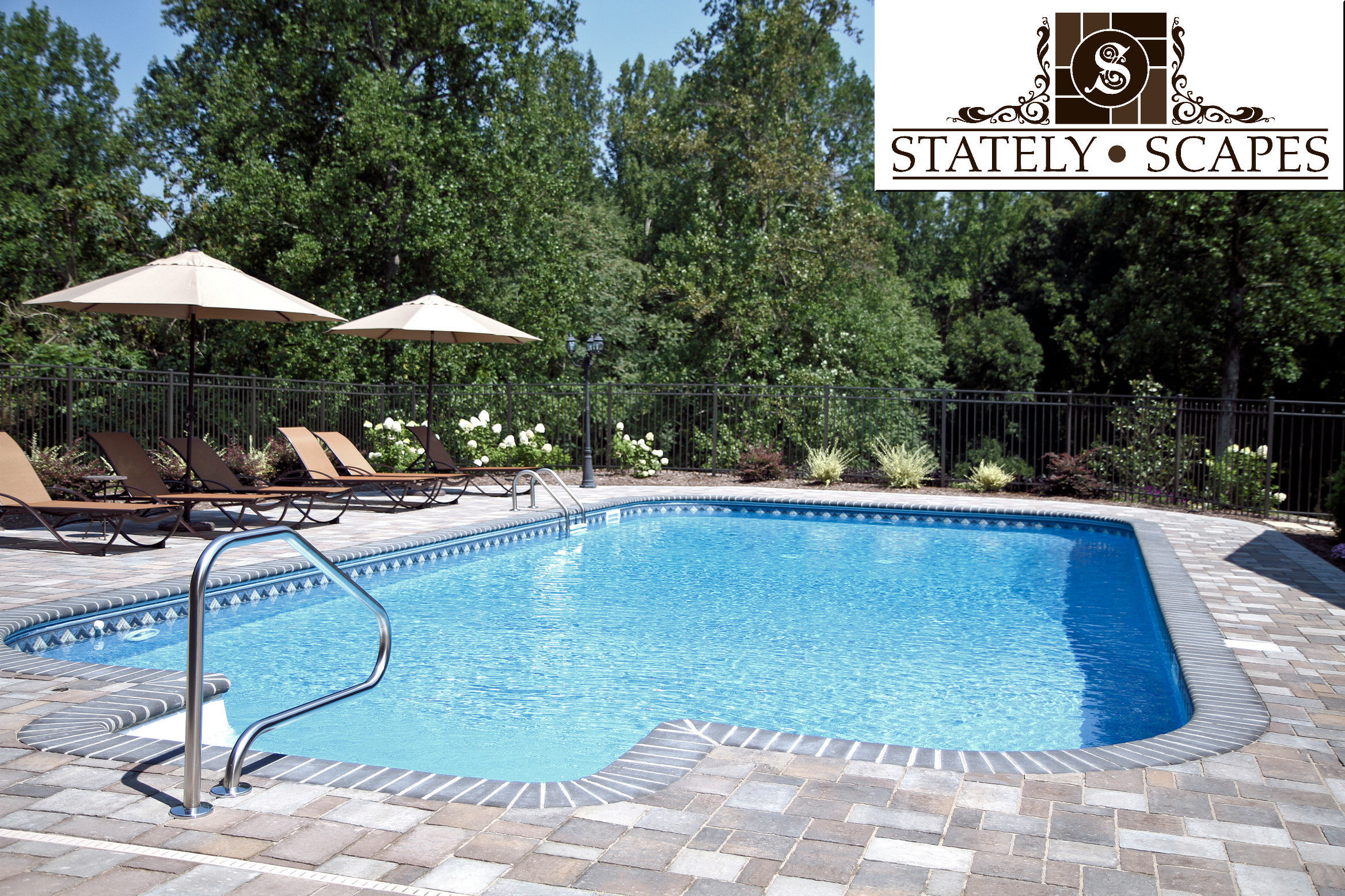 Matrix swimming pool with Belgard paver patio.