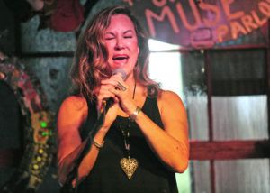Trish Hatley belts out lyrics during a performance with pianist Hans Brehmer and saxophone player John Anderson at The Conway Muse on July 27. 