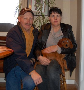 Mr. & Mrs. John Arnold with their new puppy. They got the white girl and her name is Ripley. She is going to have a great life!!