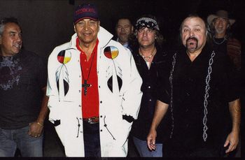 PAT VEGAS of Redbone - With 15 recordings to their credit and covers by the Real McCoy, Earth Wind & Fire and Cyndi Lauper,co-founding members Pat Vasquez and his brother Lolly created Redbone, the first commercially successful Native American rock group with an unparalled career spanning over 40 years. Pat Vasquez and his brother Lolly are of Yaqui, Shoshone, and Mexican blood. Their early recordings featured contributions from Glen Campbell, David Gates, and Leon Russell. They performed session work with Sonny and Cher, and contributed instrumentals on the Elvis Presley film soundtrack for Kissin' Cousins. Their first full-length album, Pat and Lolly Vegas at the Haunted House, was produced by Leon Russell and Snuff Garrett. The Vegas brothers met guitarist Tony Bellamy, a Yaqui Indian and a member of Peter and the Wolves in Los Angeles who had grown up in a family of dancers and musicians, and recruited him for session work with John Lee Hooker, and the Everly Brothers. According to Pat, it was Jimi Hendrix who talked the musicians into forming an all-Native American rock group. The group hired Pete "Last Walking Bear" DePoe, a Cheyenne drummer from Neah Bay Reservation, Washington. Taking its name from a Cajun epithet for "half-breed," the group Redbone signed to Epic Records in 1969, and released their debut album, Redbone, in 1970. The follow-up album, Potlatch, featured the song "Alcatraz," which dealt with the 1969 occupation of Alcatraz Island. Their first commercially successful singles were, “Maggie,” and "Witch Queen of New Orleans" (1971) which also became a huge hit in the United Kingdom. In 1973, Redbone released the political, "We Were All Wounded at Wounded Knee” which reached the #1 chart position in Europe. By 1974, Redbone had reached the Top 5 of the Billboard Hot 100 charts with "Come and Get Your Love”. The Pop/Funk/Disco song was certified Gold by the R.I.A.A for selling over one million copies and is still heard today on radio stations and commercials throughout the country. Drummer DePoe was replaced by Arturo Perez on Already Here (1972). Perez was replaced on Wovoka (1974) by Butch Rillera. (Wovoka contained the band's most successful single, "Come and Get Your Love,") In 1998 members of the group appeared as special guest performers at the inaugural Native American Music Awards. Today, Pat Vegas performs live with members of the rock group, Cannibal and the Headhunters.