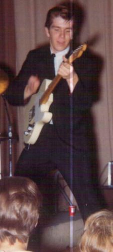 Inset from The Roots of All Evil: Me at 16. Judging by the position of my right and left hands, I think I am playing "Bo Diddley" in the nasty key of "E" ... a favourtie key for guitar players because it seriously rocks!
