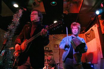 John joins Jeff on stage in December of 2005 during "You Can't Do That" and bangs a bucket (no cowbell was available).