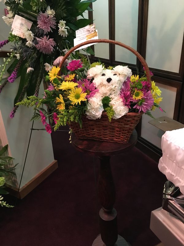 The cute little flower arrangement my friends and I sent to the funeral home. I attended the visitation, sort of in a trance. I hope you're smiling somewhere, Sherri.
