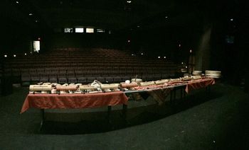 BACK VIEW: PIc #2 of a 3 Table Set Up. "Absolutely Optimal in larger venues". Here the "Log Drums" are on the table and in this way, participants walk behind the table and simply pick up a stick and play, the log drum simply stays there! Easy and it looks great.