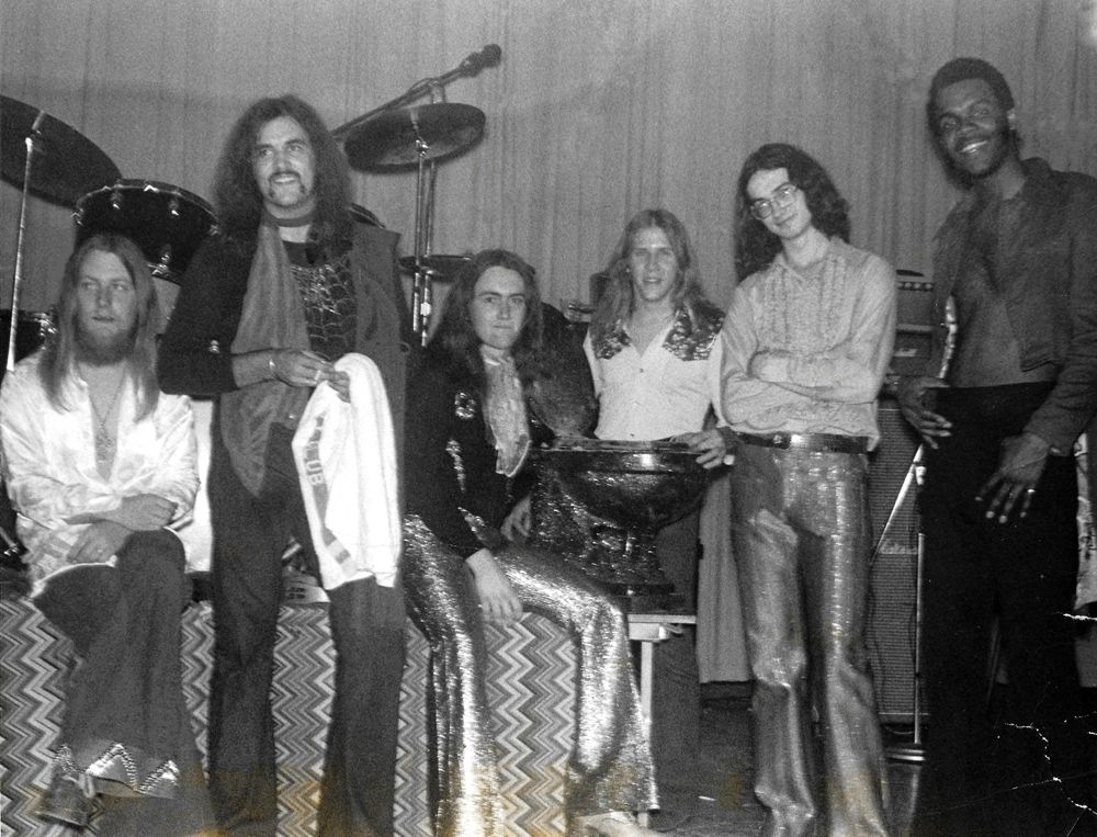Rockin' Jon posing for a post-concert photo - March 1, 1974. Bruce, Lynn, Steve, Nelson (with our "Jon"), Brad & Rick