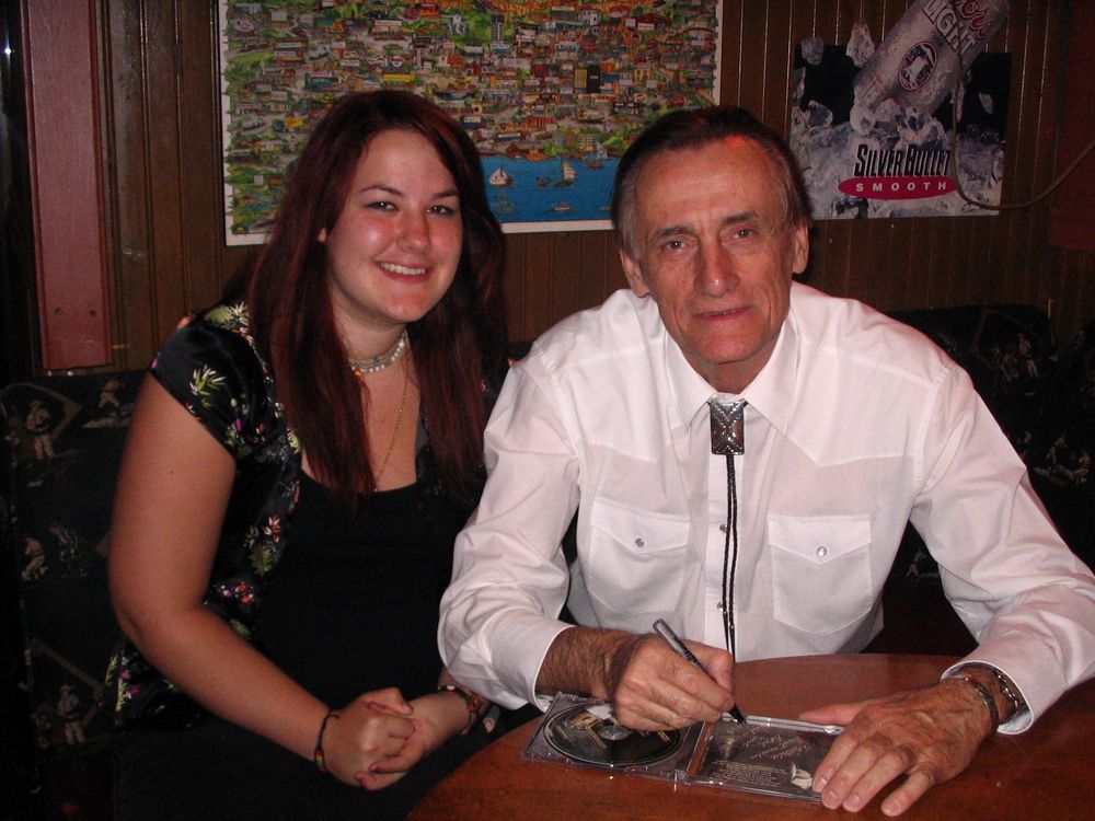 Natalie Kettings and Neil signing a CD album for Natalie ~ Photo by Joe Begej