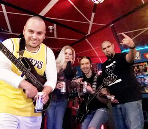 So, in case you were wondering, what does the band like to do/have during a rehearsal break? Well, the occasional beer, or, if you're our drummer, the occasional summer sausage! Cheese and crackers optional!