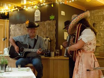 Casey Yeager visited and played some good old American country for and with us. The hotel supplied the funny hats.