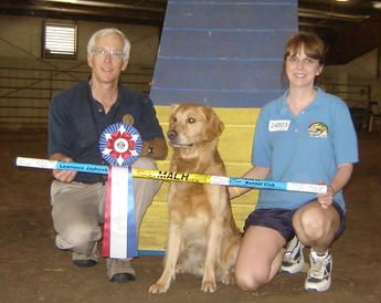 Lori and Storm with their new MACH bar!! Stormy finished his MACH by earning his 20th QQ at the Lawrence Jayhwk Kennel Club agility trial under judge Greg Beck.