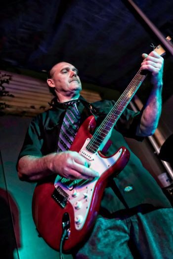 Tom O'Connor came to us from Pull the Trigger; he can play lead or rhythm effortlessly and his style dovetails with Floyd's so well that audiences are left in awe! Photo credit: Susan R. Bailey-Estes