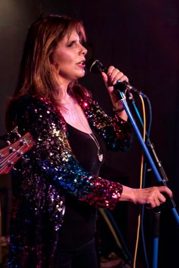 Angela Long fronts the band with a versatile, powerhouse voice. Her lead and harmony vocals propel the band and set the tone for hot tunes and dancing all night! photo credit: Susan R. Bailey-Estes