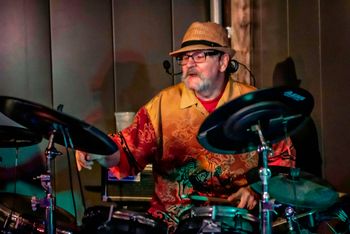 Drummer/vocalist/ Steve Pavey has been playing for over 50 years and in his younger days as a full-time musician, he worked with such talented people as Rupert Holmes and James Griffin, and he also opened for well known acts such as 3 Dog Night, Bread, Billy Preston, Uriah Heep and Steppenwolf. His mix of vocals and drumming leave people with happy feet! photo credit: Susan R. Bailey-Estes