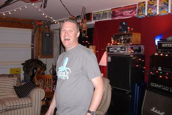 Producer Russ Fox smiles as Skid Baxter surprises him with a camera at Fox's Broadmoor Recording Studios in Huntington, WV in 2006.