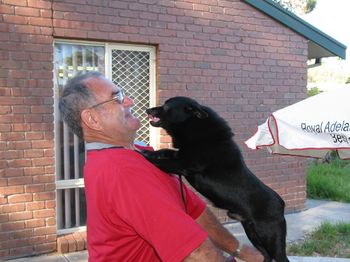 Here is Jeffy haveing some fun with his two legged Dad. "You don't think I can kiss you? just watch this!"