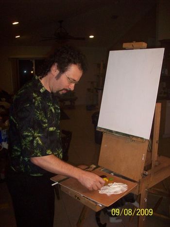 Nobody knew what to expect as Mazz started with a blank white masonite board and mixed paints together. (Click on the photo to enlarge it and then click the top right corner to proceed to the next)