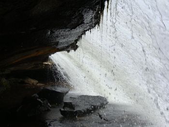 I'm standing behind the waterfall!! Since I'm so short, I could actually stand up! I had to bend over to get in, but then could stand. Awesome!!