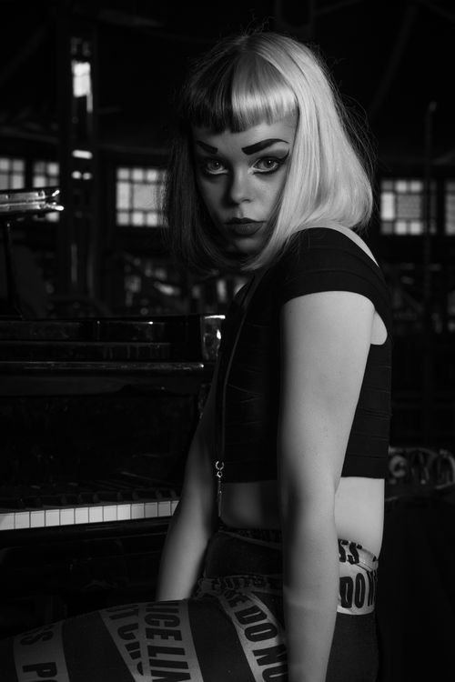 Laurie Black sits by Piano in The Famous Spiegeltent