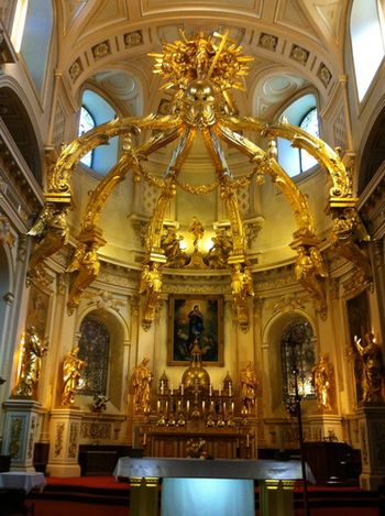 The striking main altar at Notre Dame. All the gold pieces are hand-carved and covered in gold leaf.