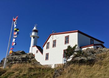 Beautiful afternoon at Lobster Cove Head Lighthouse. The lighthouse was built 1897 by shipping the iron pieces from St. John's and pulling them up the hill by oxen.
