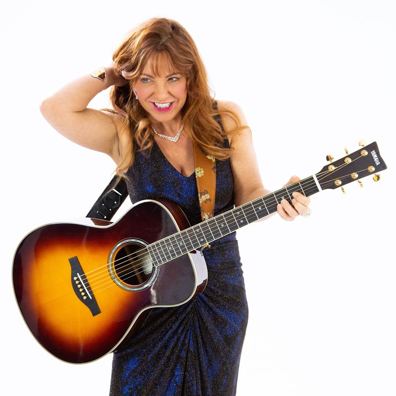 Joy Chapman with Acoustic Guitar
