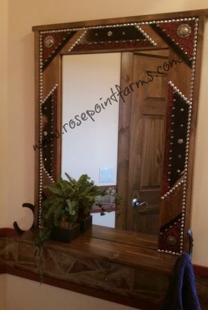 "ANGEL MIRROR" red croc and hair on cowhide, silver tacks, conchos and horseshoes. $395.00