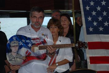 Presenting Craig Gross, aboard the Honors Cruise, a custom painted guitar with his fallen son`s image... Cpl Frank Gross - K.I.A. Afghanistan