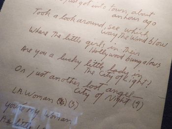 "L.A. Woman" The iconic lyrics to L.A. Woman in Jim Morrison’s own hand. The track L.A. Woman, as well as the entire album by the same title, was recorded here at 8512 Santa Monica Blvd., then The Doors’ Workshop (rehearsal hall/offices). The album was recorded downstairs, with producer Paul Botnick and the mixing board located upstairs. The vocals were sung by Morrison were performed in and recorded from the downstairs bathroom.