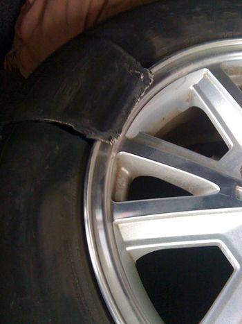 My tire which blew out on the way home. The tire man thought it must have been hit with debris and weakened it.