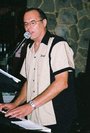 Brad Dronen - Keyboard and Vocals - Brad began playing at age 17 with the Richfield, Minnesota-based band "Echoes of Silence." A professionally-trained keyboardist, Brad played casually until co-founding "American Flyer" with guitarist Mark Eggan in 2001. Brad's energy and flexibility of style show a remarkable natural talent and add a fullness and richness to the band's sound...