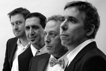 L to R: Paul Gillett (guitar + vox), Enzo Ruberto (bass), Salvatore Greco (accordion), Jon Delaney (guitar)