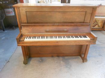1911 Steinway Model K, This one was factory Ebonized but someone stripped and clearcoated it. The wood beneath was not stain grade so we returned it to its original color. We usually have a few Model K steinways in stock