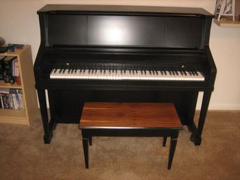 Same 1964 Kohler& Campbell Studio Piano after we filled all the scratches and dents, Put a new Satin Black Urethane finish on it and replaced the key tops. It also had some mechanical work done as well.